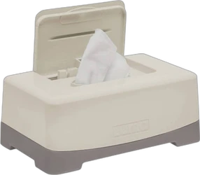 Crèmekleurige Luma wipe box met grijze onderrand, open deksel en wit doekje dat uit de opening steekt.