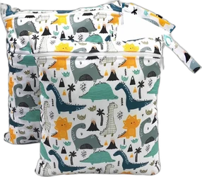 Twee witte wetbags met rits, polsbandje en kleurrijke cartoon dino print met palmbomen en vulkanen
