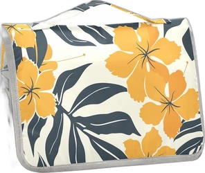 Draagbaar verschoonkussen met Hawaïaans bloemenpatroon Opgevouwen verschoonkussen met gele bloemen, donkerblauwe bladeren en grijze rand op lichte achtergrond