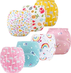 Zeven kinder oefenbroekjes met dieren, regenbogen, muzieknoten en kleurrijke prints op witte achtergrond.