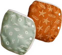 Set van twee herbruikbare luiers met tropical motief groen met palmbomen en oranje met zeesterren