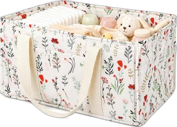 ShopVlot luierorganizer mand wit met bloemen print Witte stoffen luiermand met kleurrijke bloemenprint en handgrepen gevuld met luiers en babyartikelen