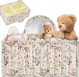 Beige luierorganizer caddy met roze groene bloemenprint en twee knuffels gevuld met verzorgingsartikelen