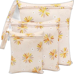 Set van drie beige wetbags met gele bloemprint in verschillende maten en ritsen