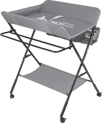 Grijze opklapbare luiertafel met verhoogde rand op metalen frame en opbergvak aan de zijkant