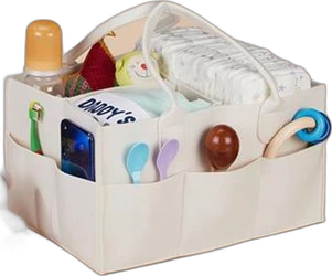 Zoranta luiertafel-organizer 11 vakken beige Beige luiertafel-organizer met 11 vakken gevuld met flesje, lepels, luiers en babyspelgoed