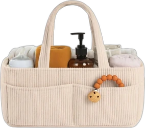 Crème corduroy luiercaddy met handvat en meerdere vakken Crème corduroy luiercaddy met handvat gevuld met babyfles doekjes en flesje met pomp