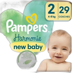 Verpakking Pampers Harmonie New Baby maat 2 met 29 luiers, groene hartvorm en babyfoto rechts.
